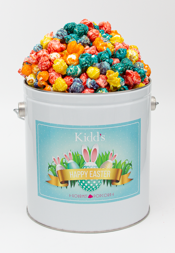 Bright, Rainbow Popcorn In Small Easter Basket Tin. Orange, Lemon, Blue Raspberry, Grape, Vanilla candy flavors.