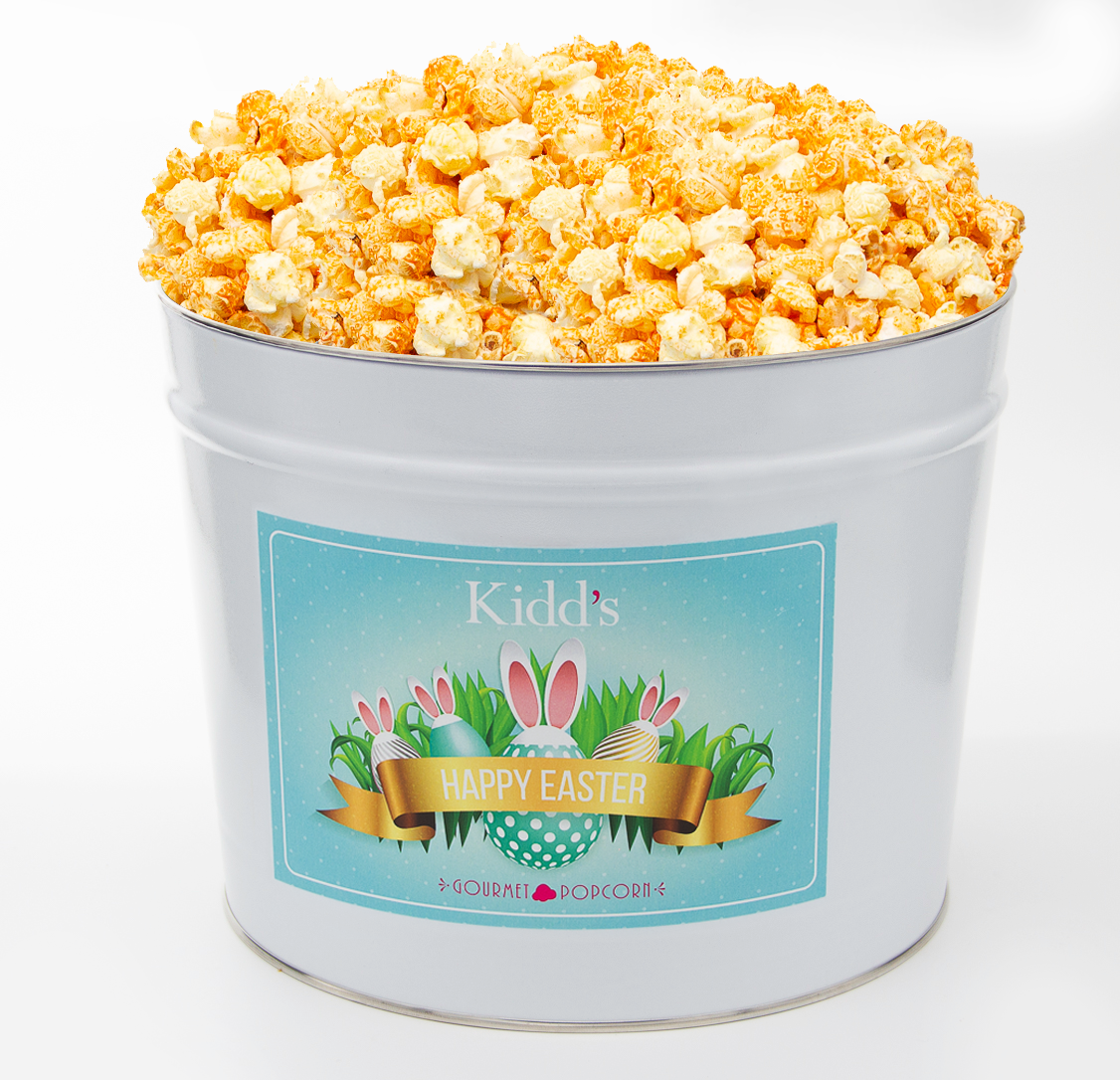 mouthwatering Cheesy Cheddar and White Cheddar Gourmet Popcorn in a Deliverable Rabbit and Easter Egg Popcorn Bucket.