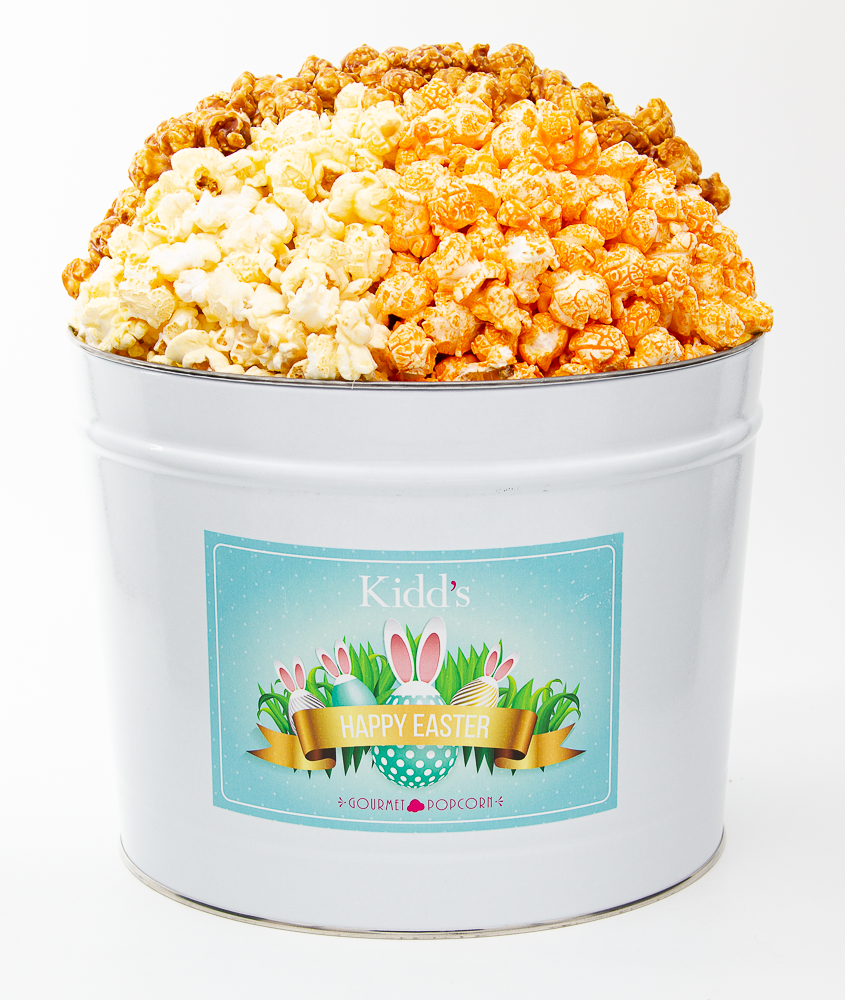 medium basket gift popcorn for easter. filled with savory, cheesy cheddar, white cheddar and sweet caramel popcorn.