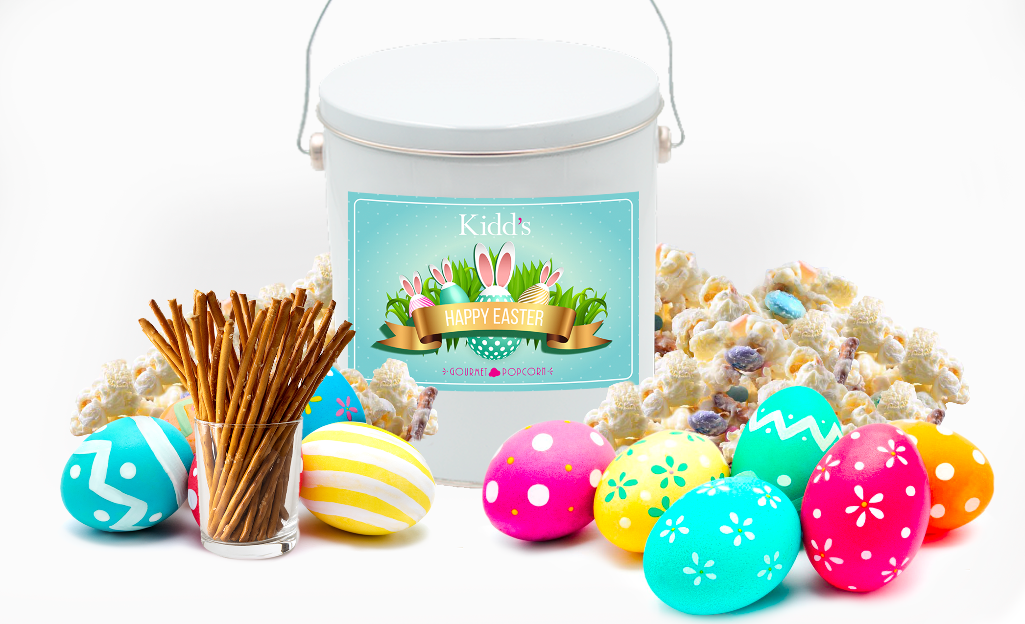 Flavorful Vanilla Popcorn Mixed with Pretzels, M&M's, White Chocolate Popcorn served in Easter Basket Tin with Bunny Rabbit and Easter Eggs decoration. 