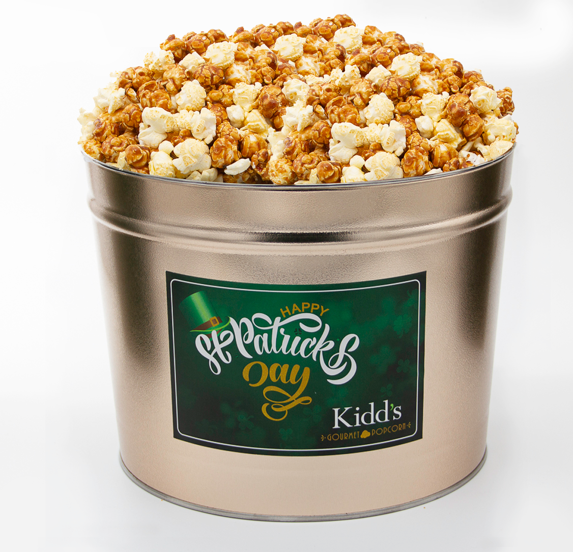 the best caramel and creamy white cheddar popcorn mix in shippable gold st. patrick's day popcorn tub.