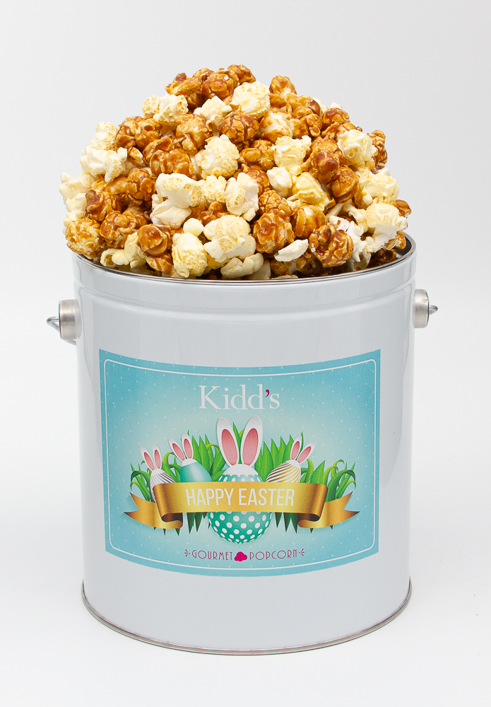 Decadent Caramel and real white cheddar gourmet popcorn in small easter tin.