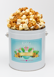 Decadent Caramel and real white cheddar gourmet popcorn in small easter tin.