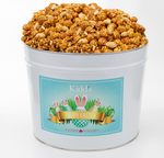 Load image into Gallery viewer, crunch, salty peanuts, sweet caramel corn combined in medium Easter Basket Gift Tin.
