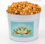 Load image into Gallery viewer, Famous Cheddar and Caramel Popcorn in medium popcorn tin. Perfect for Easter family gatherings.
