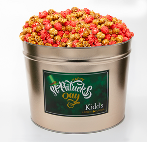 2 gallon gold gourmet popcorn tin filled with Artisan Popcorn flavors Caramel and Cinnamon.