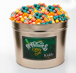 Load image into Gallery viewer, medium St. Patrick&#39;s Day deliverable popcorn tin filled with popular rainbow corn. Lemon, Orange, Grape, Blue Raspberry, vanilla flavors.
