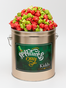 Tart Green Apple Popcorn mixed with RedHots cinnamon popcorn in St. Patrick's Day 1 gallon snack tin.